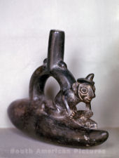 pge0002  pot in shape of rider on a reed raft
